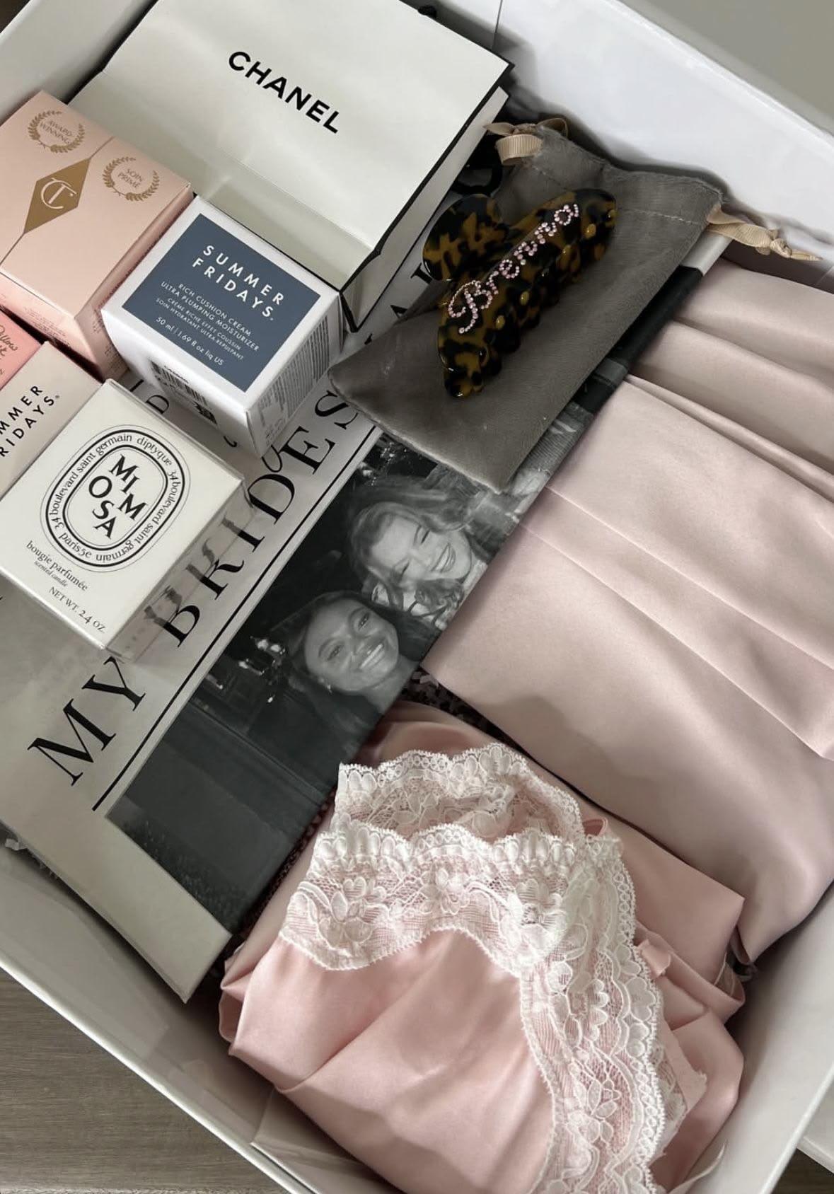 A bridesmaid box with silk robe, lace trim, perfume and beauty favourites